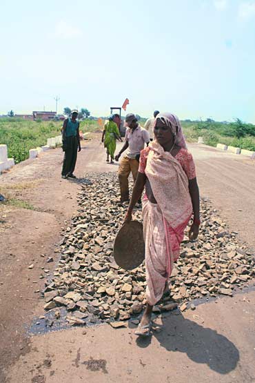 Govt's dual-strategy: Pave the road plus give work to labourers as part of the NREGA