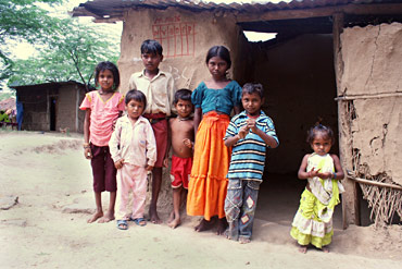 Village kids in front of their huts