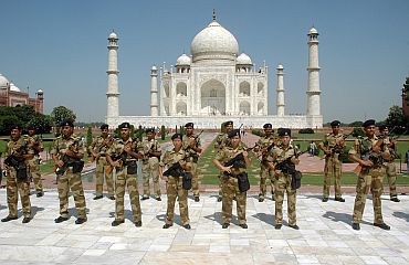 Paramilitary troopers stand guard at the Taj Mahal, September 29