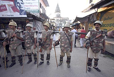 Paramilitary troopers stand guard in Ayodhya