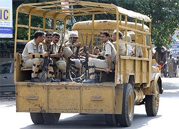 Paramilitary troopers patrol a road in Ayodhya