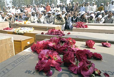 A file photo of the coffins of unidentified victims of the Samjhauta Express blast