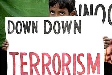 A boy participates in a demonstration to condemn the Samjhauta Express blast