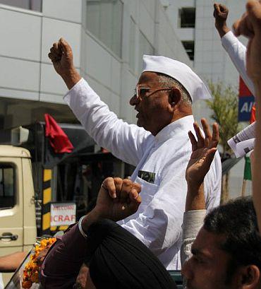 Social activist Anna Hazare addresses supporters as he began his fast unto death against corruption in New Delhi on Tuesday.