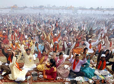 People perform yoga as part of prayers for world peace
