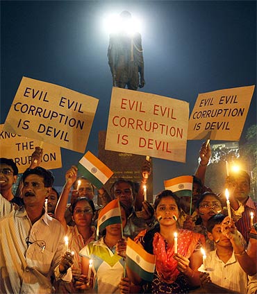 Hazare's supporters participate in a candlelight vigil against corruption in Ahmedabad