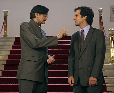 Colombia's Foreign Minister Bermudez listens to former External Affairs Minister of State Shashi Tharoor during a meeting in Bogota