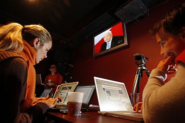 Two American bloggers sit in front of their computers in New Hampshire