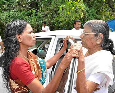 Gowri Amma talking to a voter, as she gets ready to leave for her next campaign venue