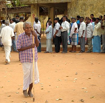 An old man arrives at a polling booth in Sorapet, to cast his vote in Puducherry