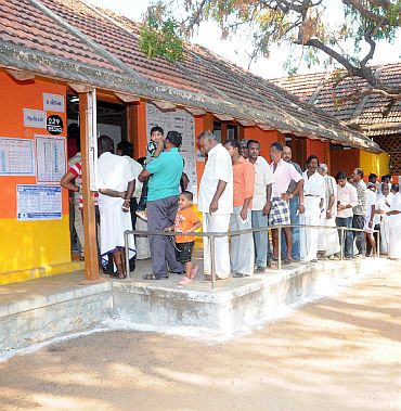 Voters in a queue at a polling booth to cast their vote at Kanyakumari
