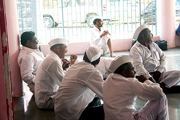 Villagers in Ralegan Siddhi wait to talk to Anna Hazare inside a temple