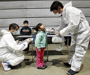 A five-year-old is being tested for possible radiation exposure at an evacuation center in Koriayama, Fukushima Prefecture