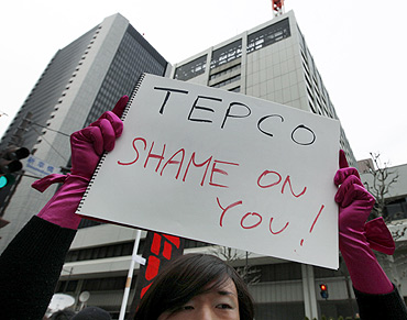 An anti-nuclear protester outside the TEPCO headquarters