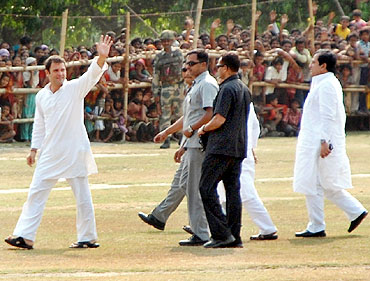 Rahul Gandhi waves to the crowd gathered for his rally in West Bengal