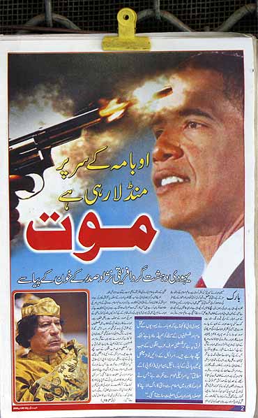 The frontpage of  a newspaper reads: Death is flying over Obama's head