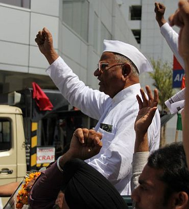 Social activist Anna Hazare on his way to Jantar Mantar to begin his fast unto death against corruption