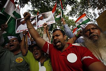 Supporters of Anna Hazare shout slogans during a protest rally against corruption in Mumbai