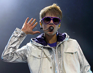 Canadian pop singer Justin Bieber performs on stage during his concert in Singapore