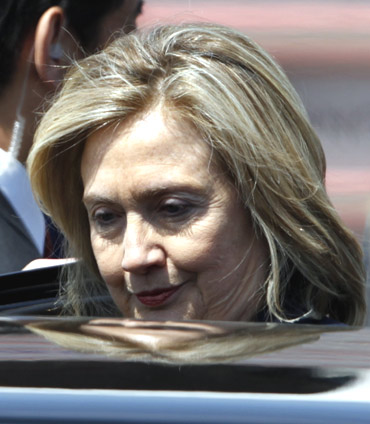 US Secretary of State Hillary Clinton gets on a car after arriving at Haneda airport in Tokyo