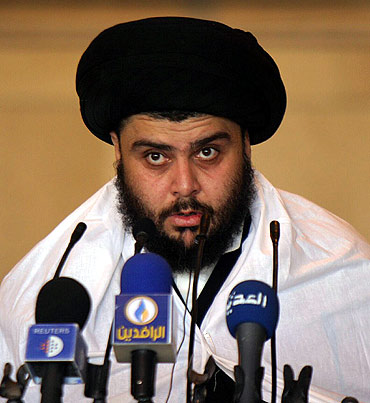 Iraqi Shi'ite radical leader Muqtada al-Sadr delivers a sermon to worshippers in Najaf, Baghdad