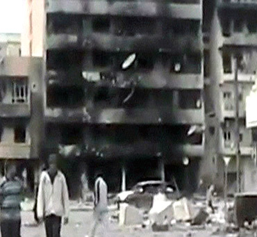 A damaged building is seen in an area purported to be in Misrata in this still image from a video