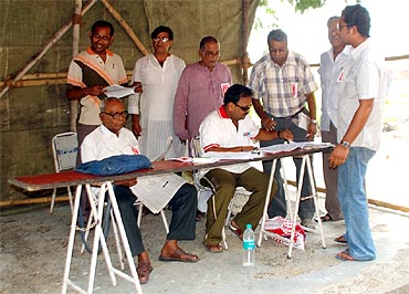Officials at a polling booth in Kolkata