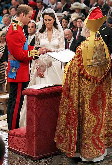 Prince William, and Kate Middleton exchange rings before the Archbishop of Canterbury, Rowan Williams, during their wedding ceremony in Westminster Abbey on Friday