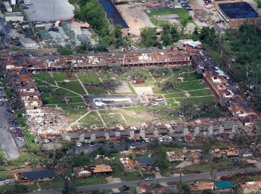 An aerial view shows extensive damage to homes and businesses in the path of tornadoes in Tuscaloosa