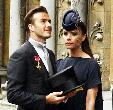Soccer star David Beckham and his wife Victoria arrive at Westminster Abbey before the wedding