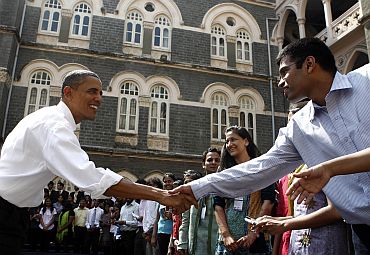 President Obama greets students after a town hall meeting at St Xavier's College in Mumbai