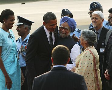 President Obama and the first lady are greeted by PM Singh and his wife upon their arrival at New Delhi's airport