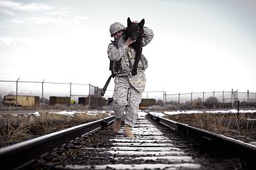 Handout image shows a US Navy SEAL commander with his military dog