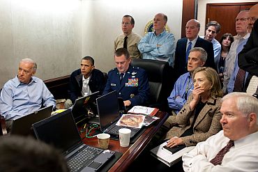 US President Barack Obama and Vice President Joe Biden, along with members of the national security team, receive an update on the mission against Osama bin Laden in the Situation Room of the White House