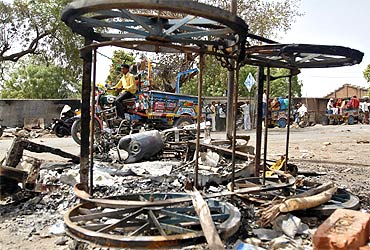 A file photo of burnt vehicles at the site of a clash between Dalits and upper caste Hindus