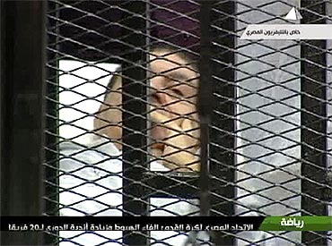 Former Egyptian president Hosni Mubarak in the courtroom for his trial at the police academy in Cairo