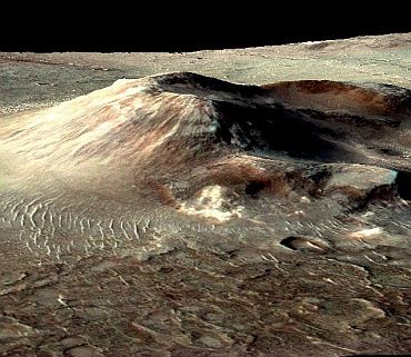 This volcanic cone in the Nili Patera caldera on Mars has hydrothermal mineral deposits on the southern flanks and nearby terrains. The deposits are evidence for a past local environment that was warm and wet or steamy, possibly hospitable to microbial life