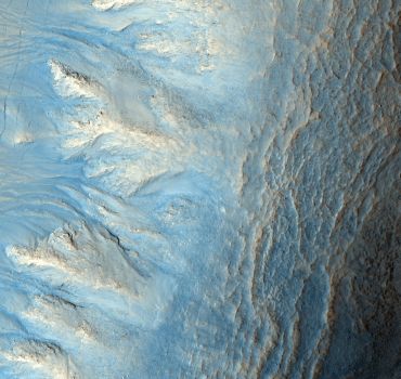 This image shows the west-facing side of an impact crater in the mid-latitudes of Mars' northern hemisphere