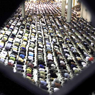 Muslim women attend mass prayer session Tarawih at Al Akbar mosque in Surabaya, East Java, Indonesia