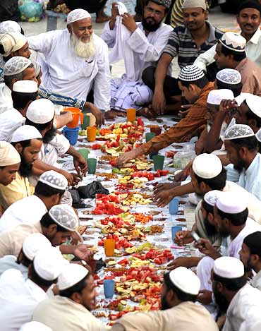 Muslims eat Iftar at a mosque in Ahmedabad