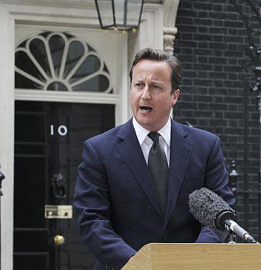 Britain's Prime Minister David Cameron speaks to the media