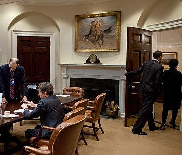 President Obama and Senior Advisor Valerie Jarrett depart the Roosevelt Room