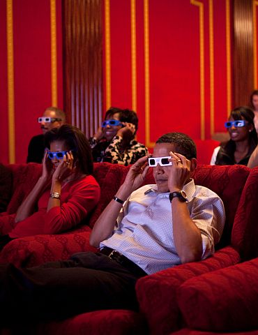 President Barack Obama and First Lady Michelle Obama wear 3-D glasses while watching a TV commercial during Super Bowl 43, Arizona Cardinals vs Pittsburgh Steelers, in the family theatre