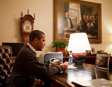 President Barack Obama sits at his desk in the Treaty Room Office