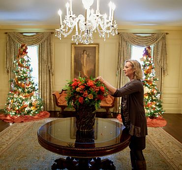 Chief Floral Designer Laura Dowling arranges a bouquet in the Vermeil Room of the White House