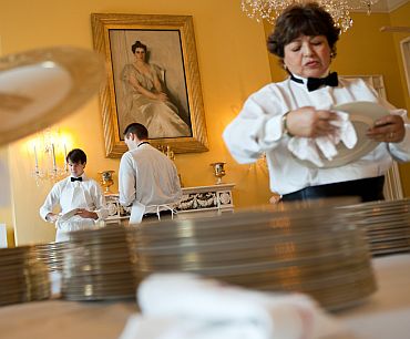 Residence staff prepare for the State Dinner in the Old Family Dining Room of the White House