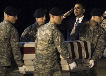 US President Barack Obama participates in the dignified transfer of Army Sgt Dale R Griffin at Dover Air Force Base, Delaware