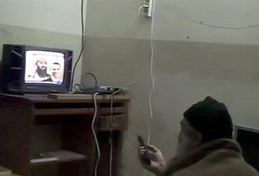 Osama bin Laden is shown watching himself on television, with US President Barack Obama also on screen, in this video frame grab released Pentagon