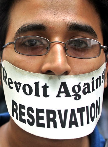 A medical student with an anti-reservation poster during a protest in a Kolkata hospital