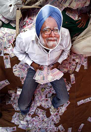 A BJP activist wears a mask depicting Prime Minister Manmohan Singh during an anti-government protest